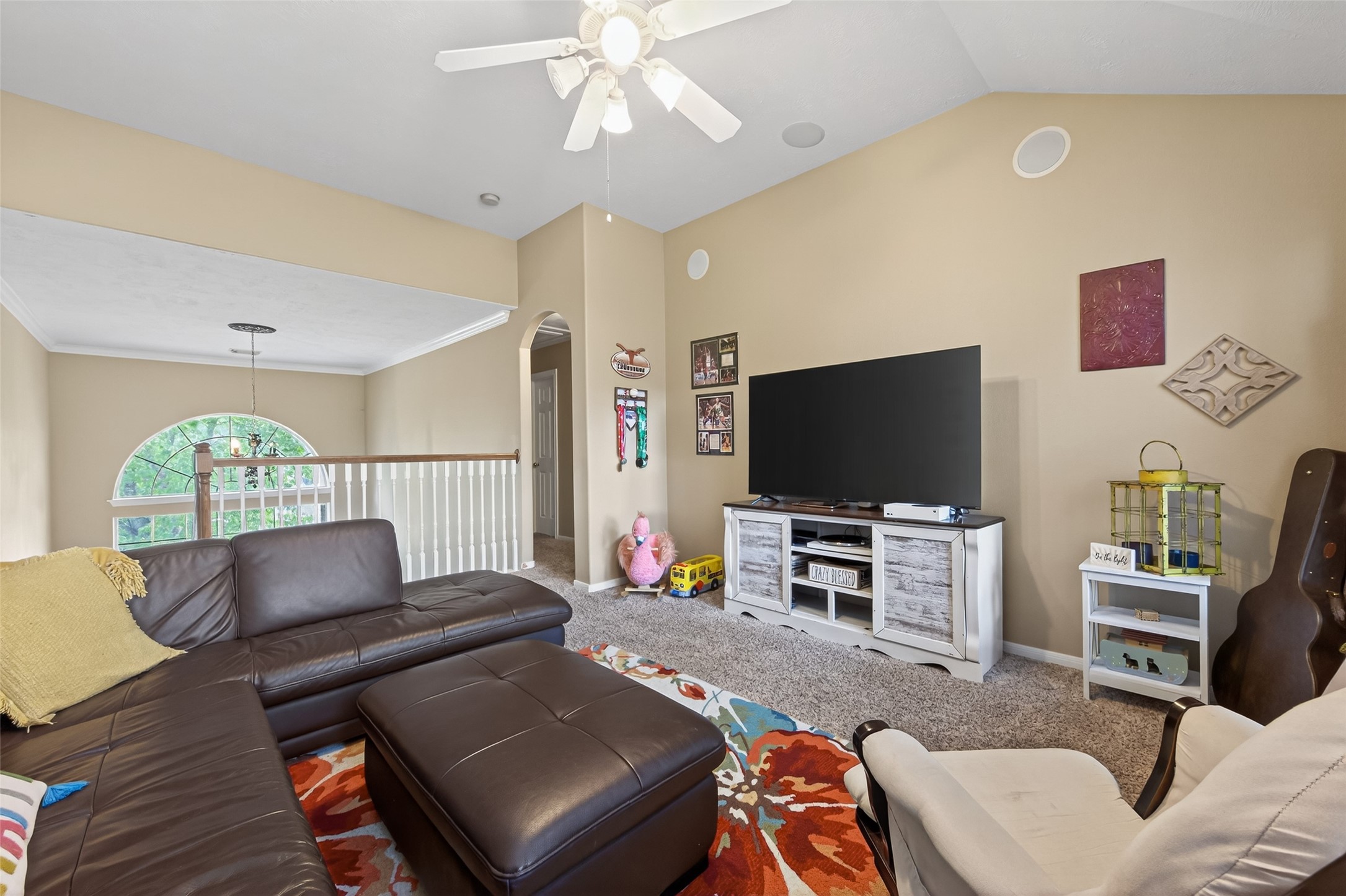 59 Genesee Ridge Drive Conroe, TX 77385 - Photo 31 of 44 a living room with furniture and a flat screen tv