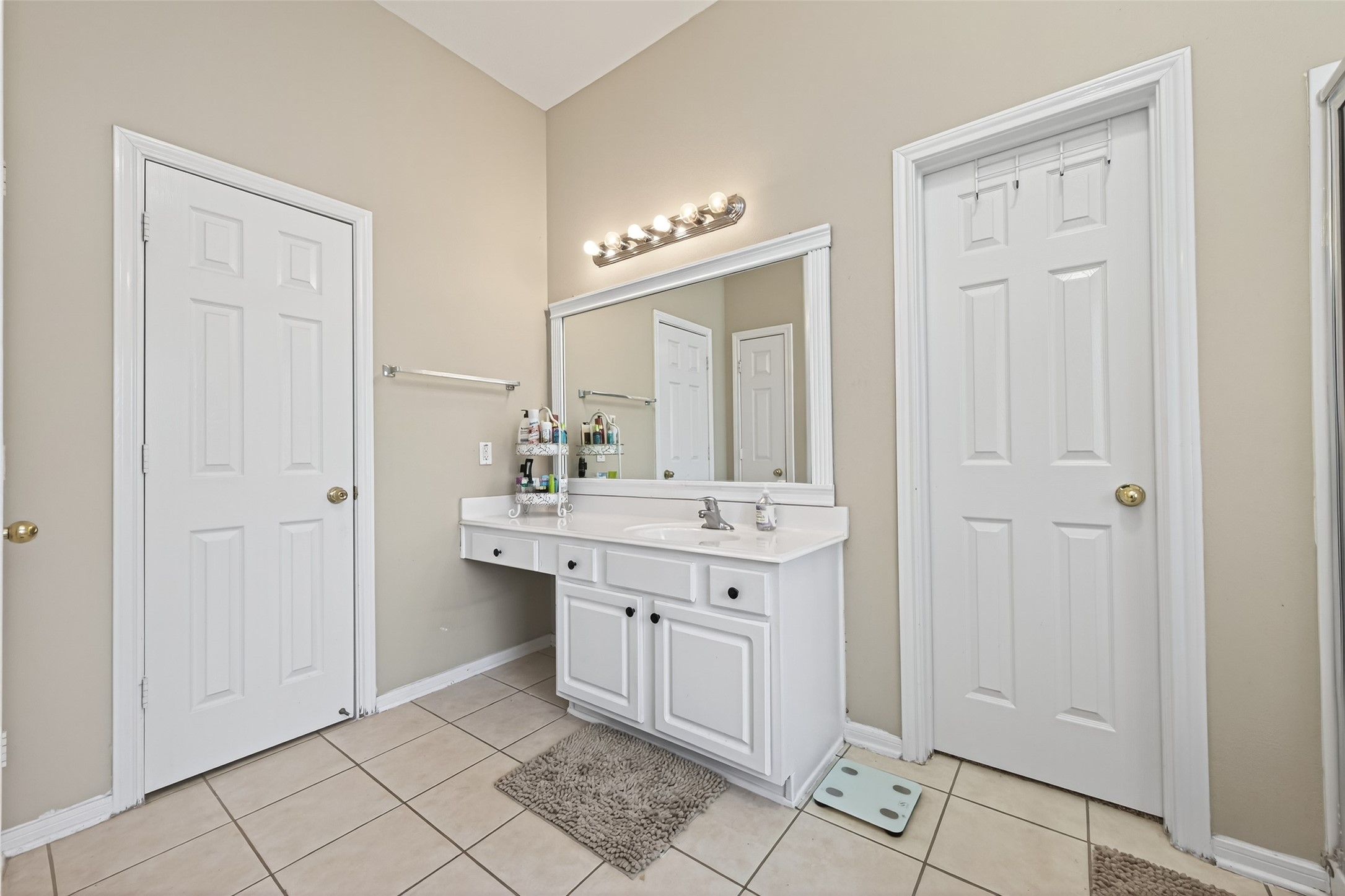 59 Genesee Ridge Drive Conroe, TX 77385 - Photo 35 of 44 a bathroom with a double vanity sink a mirror and a