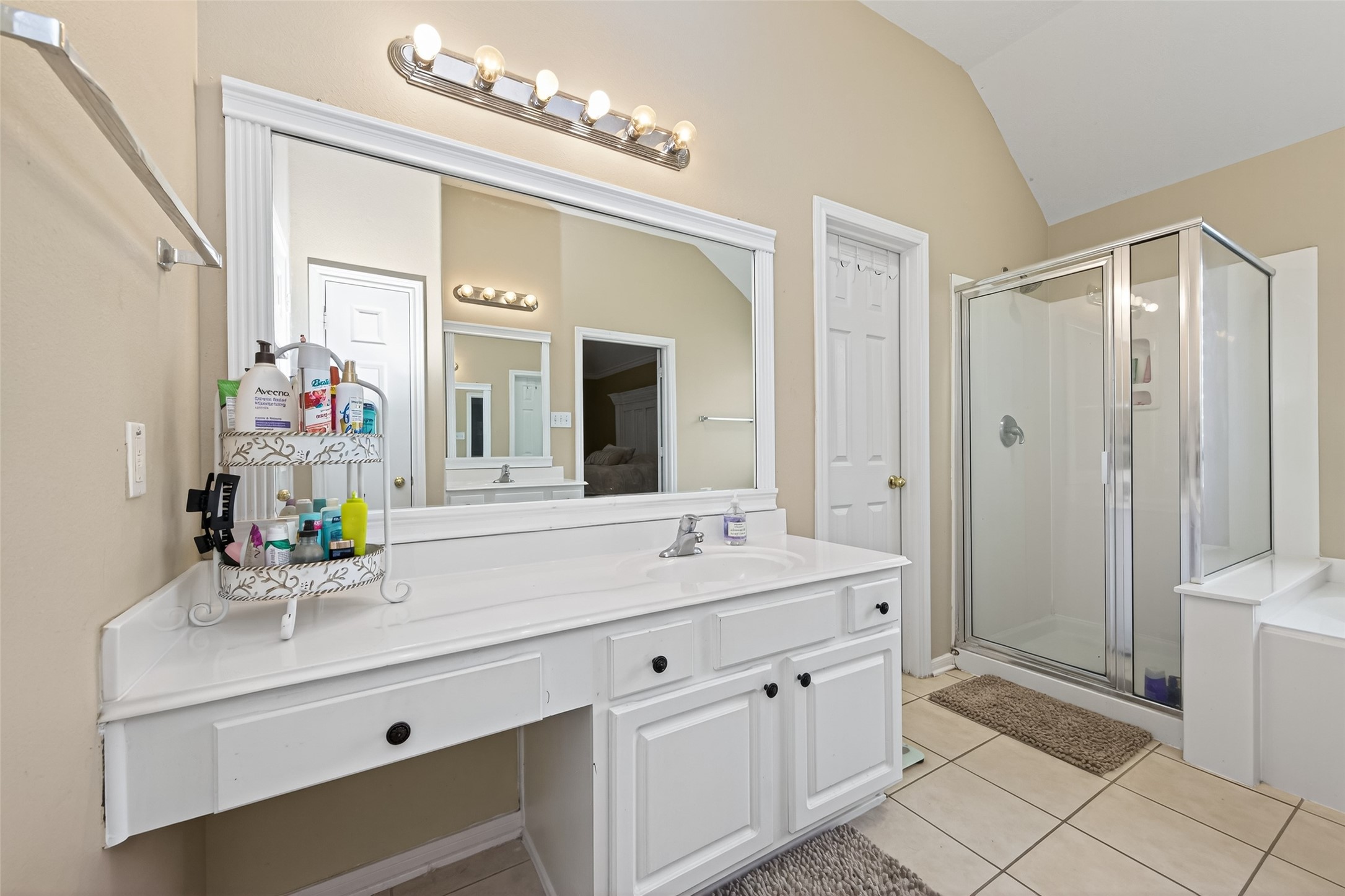 59 Genesee Ridge Drive Conroe, TX 77385 - Photo 38 of 44 a bathroom with a sink double vanity and a mirror