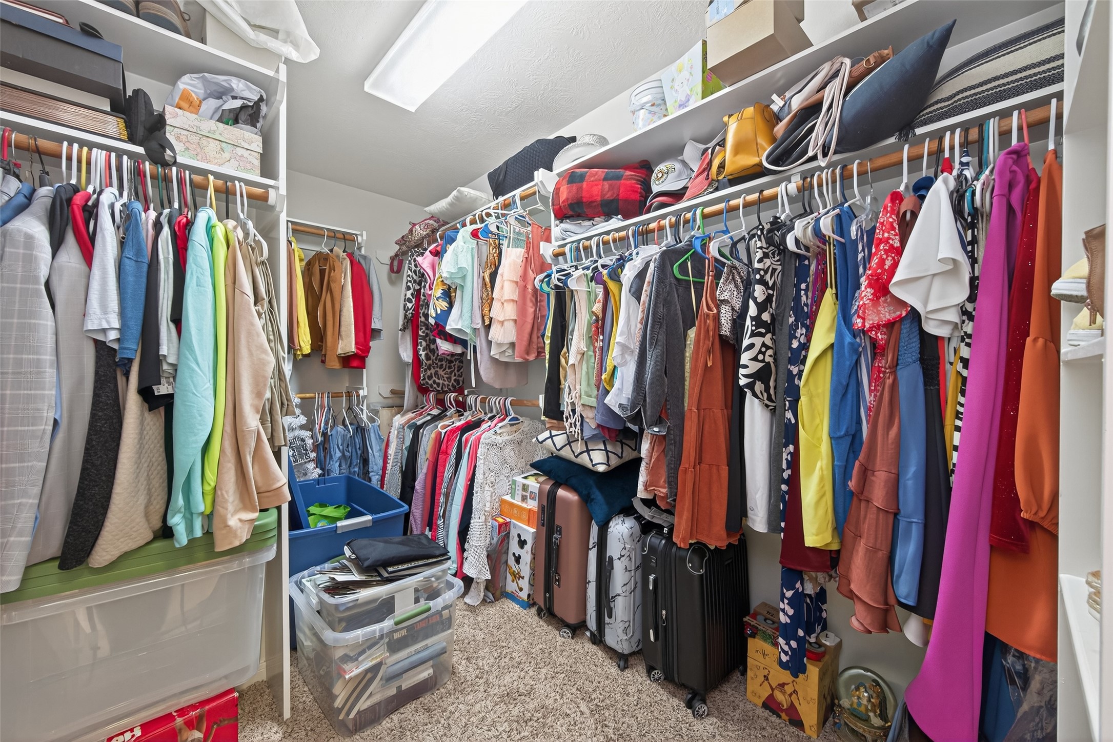 59 Genesee Ridge Drive Conroe, TX 77385 - Photo 39 of 44 a view of walk in closet with clothes
