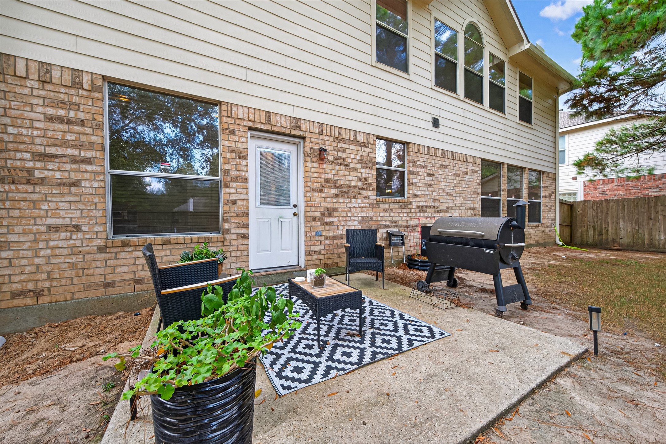 59 Genesee Ridge Drive Conroe, TX 77385 - Photo 44 of 44 a view of a patio with couches chairs and a potted plant