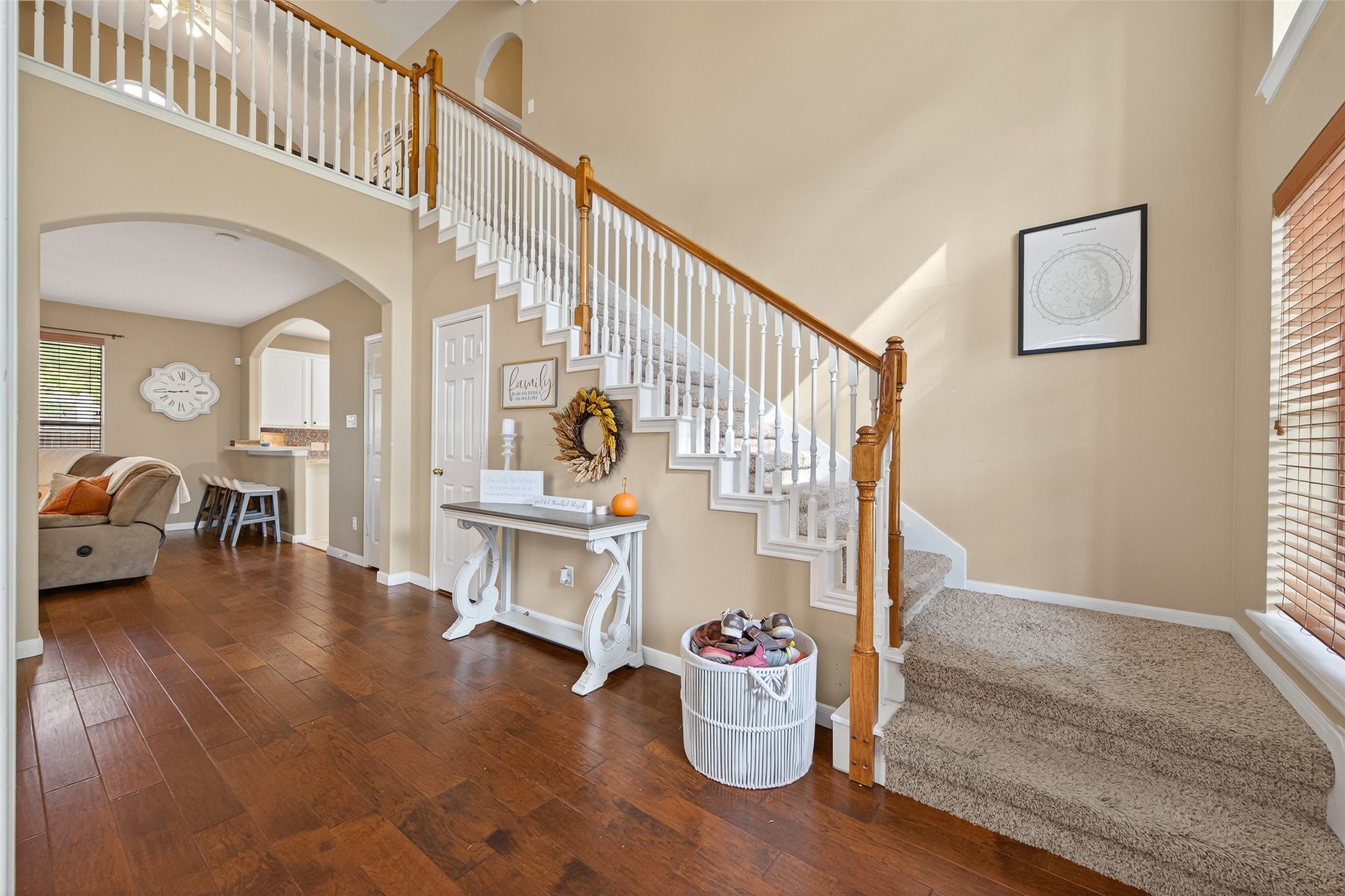 59 Genesee Ridge Drive Conroe, TX 77385 - Photo 8 of 44 a living room with couches and a dining table with wooden floor