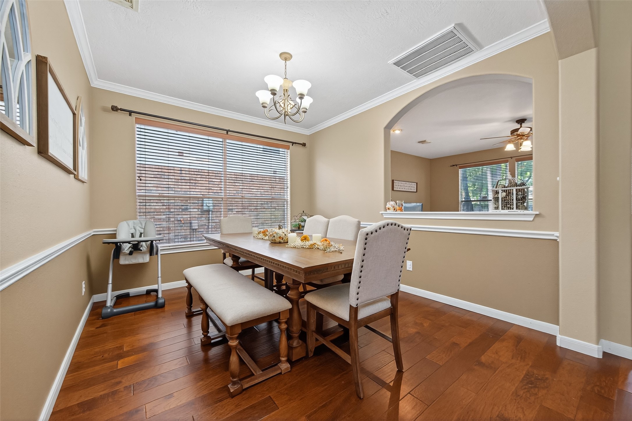 59 Genesee Ridge Drive Conroe, TX 77385 - Photo 10 of 44 a view of a dining room with furniture window and wooden floor