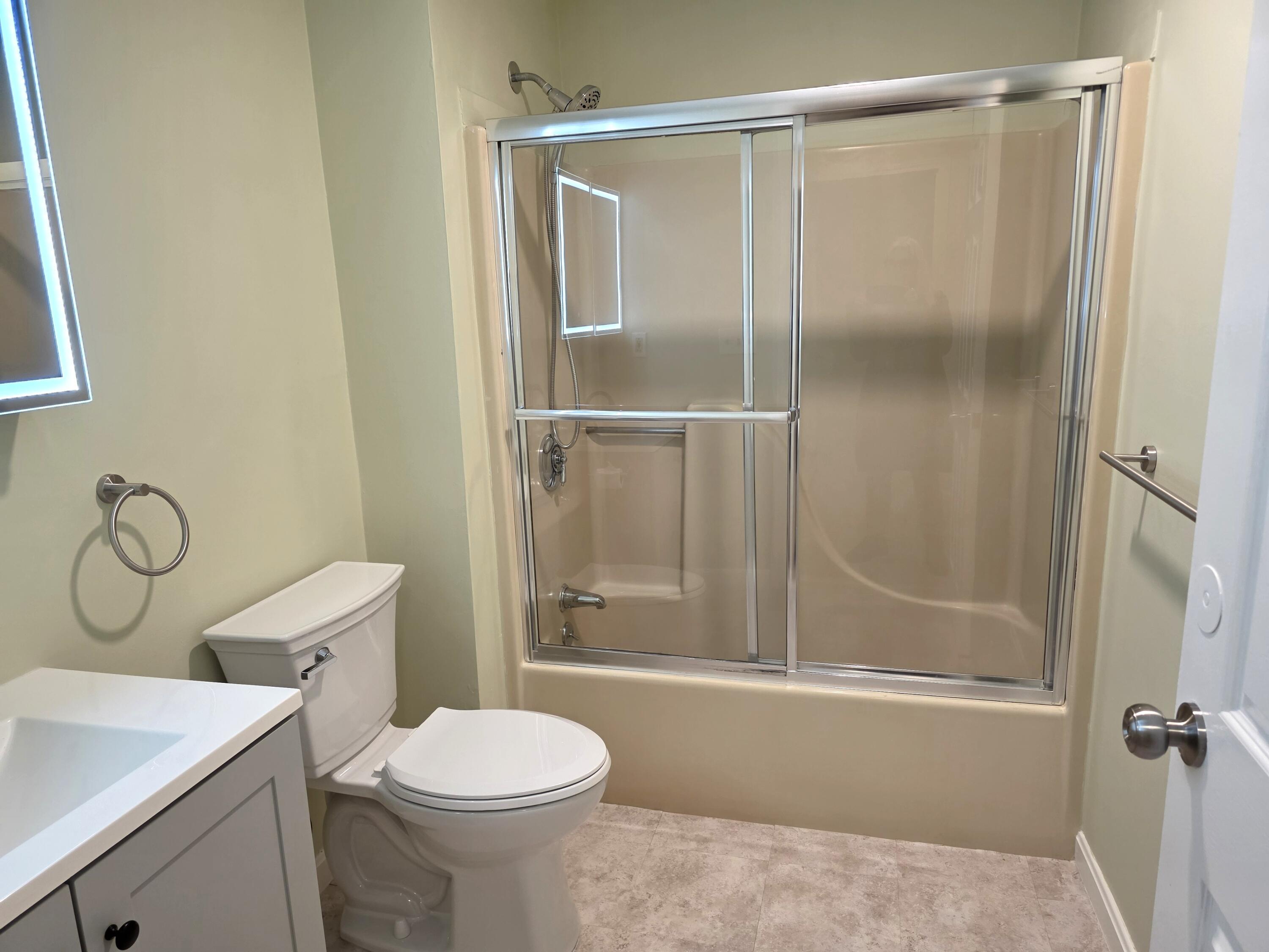 720 Pitchers Way, Unit F52 Hyannis, MA 02601 - Photo 11 of 25 a bathroom with a toilet sink vanity and shower