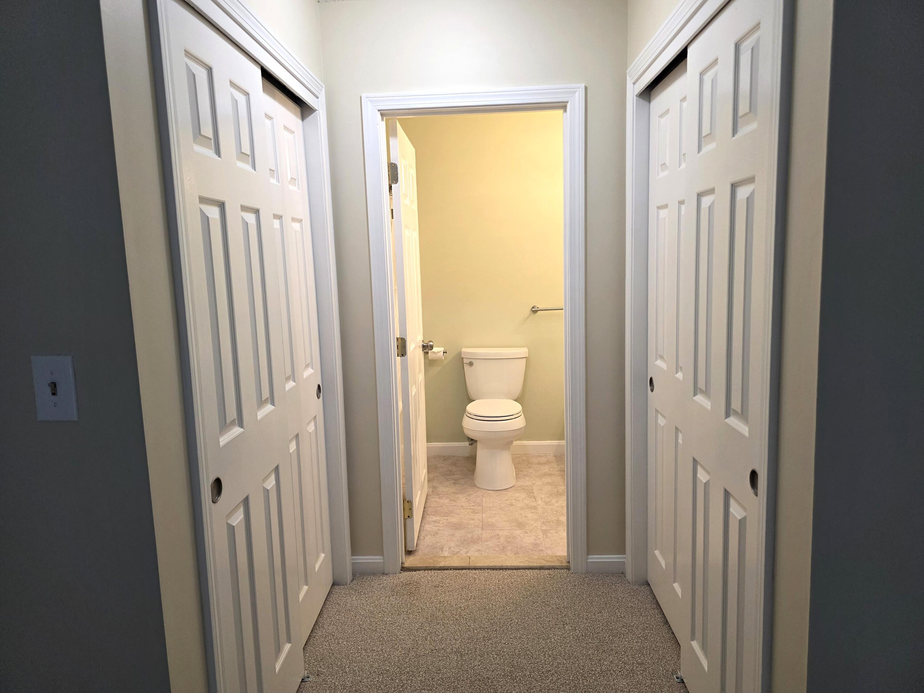 720 Pitchers Way, Unit F52 Hyannis, MA 02601 - Photo 19 of 25 a view of a bathroom with a door and a toilet