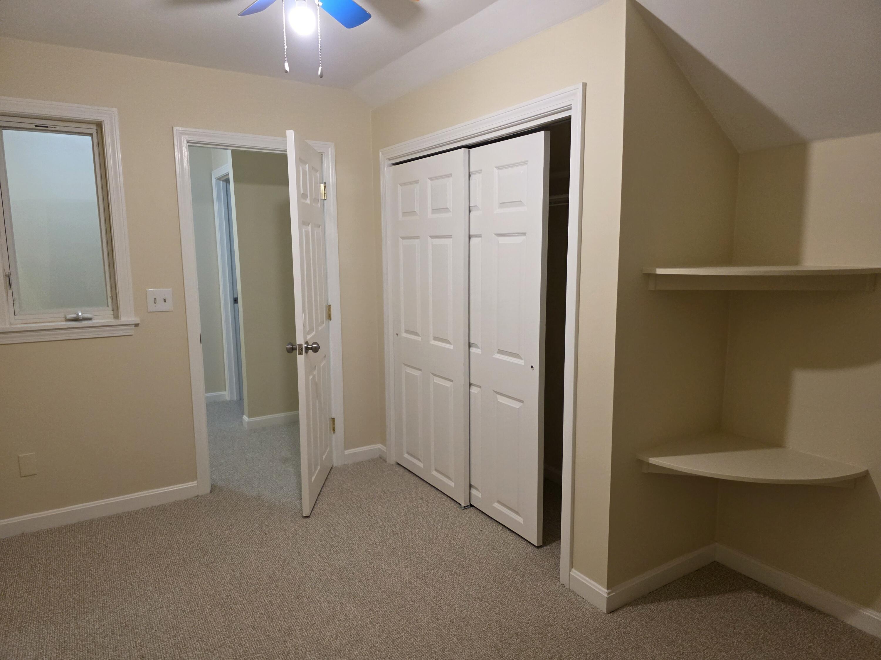 720 Pitchers Way, Unit F52 Hyannis, MA 02601 - Photo 25 of 25 an empty room with closet and windows