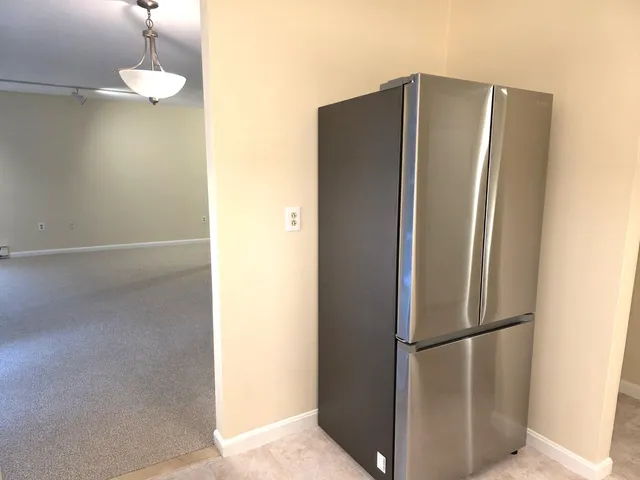 a view of a refrigerator in a kitchen