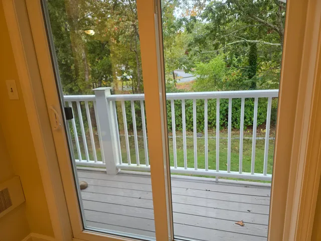a bathroom with a toilet sink vanity and shower