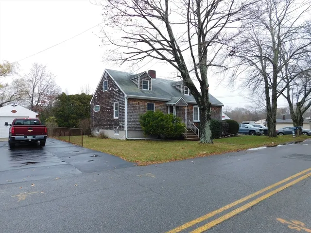 a view of road with houses and trees