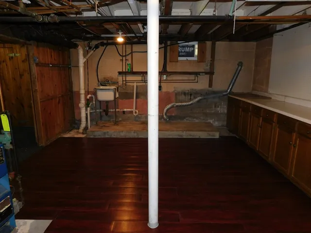 a view of living room with furniture and wooden floor