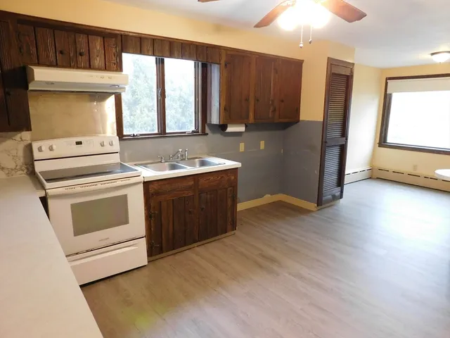 a bathroom with a sink a toilet and tub