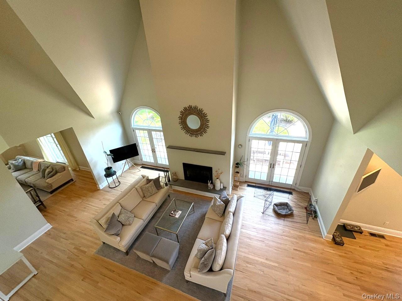 365 Chablis Path Southold, NY 11971 - Photo 14 of 30 a living room with furniture fireplace and wooden floor