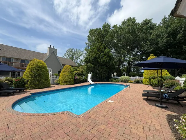 a view of yard with patio