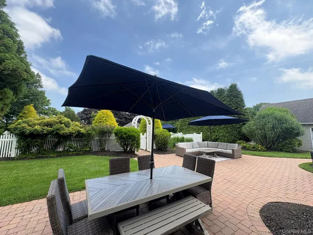 a view of a backyard with large trees
