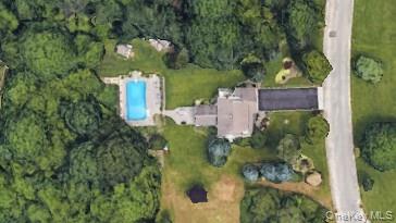 365 Chablis Path Southold, NY 11971 - Photo 30 of 30 an aerial view of a house with a yard and large trees