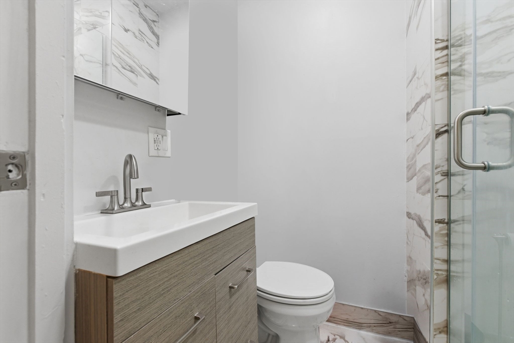21 Beacon Street, Unit 11L Boston, MA 02108 - Photo 9 of 23 a bathroom with a sink toilet and shower