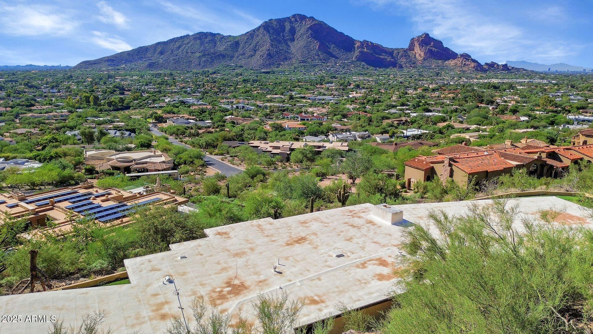 7040 North Invergordon Road Paradise Valley, AZ 85253 - Photo 3 of 11 a view of a house with a mountain