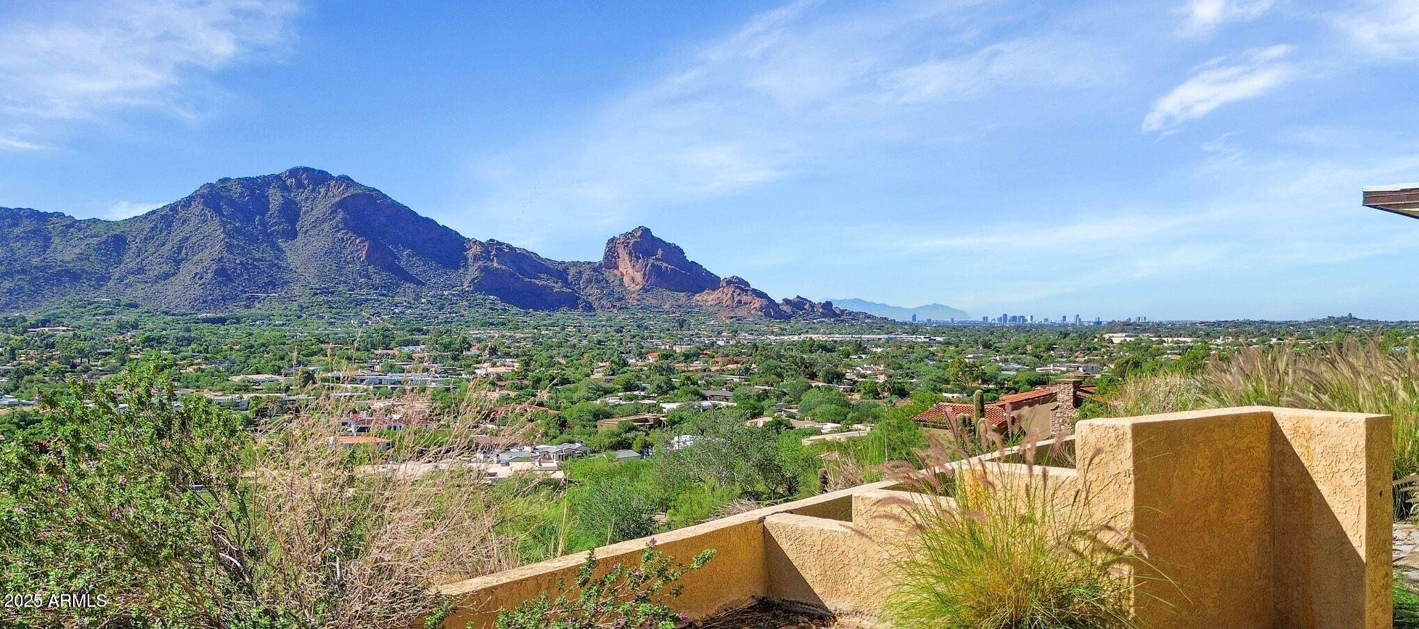 7040 North Invergordon Road Paradise Valley, AZ 85253 - Photo 4 of 11 a view of a lake with a mountain in the background