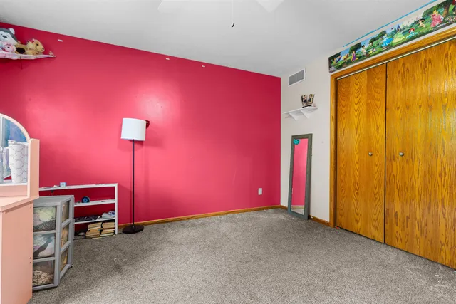 a room with wooden floor and furniture