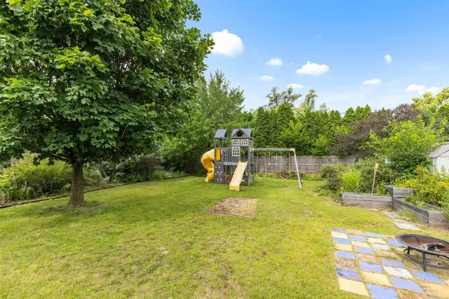 a swimming pool with some trees and plants