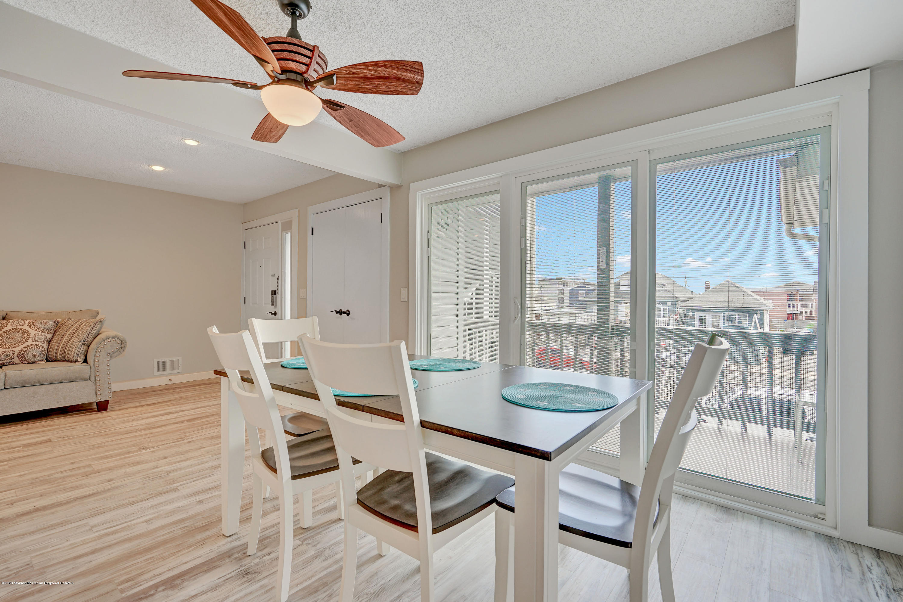 42 Hamilton Avenue, Unit B11 Seaside Heights, NJ 08751 - Photo 12 of 24 a view of a dining room with furniture window and wooden floor