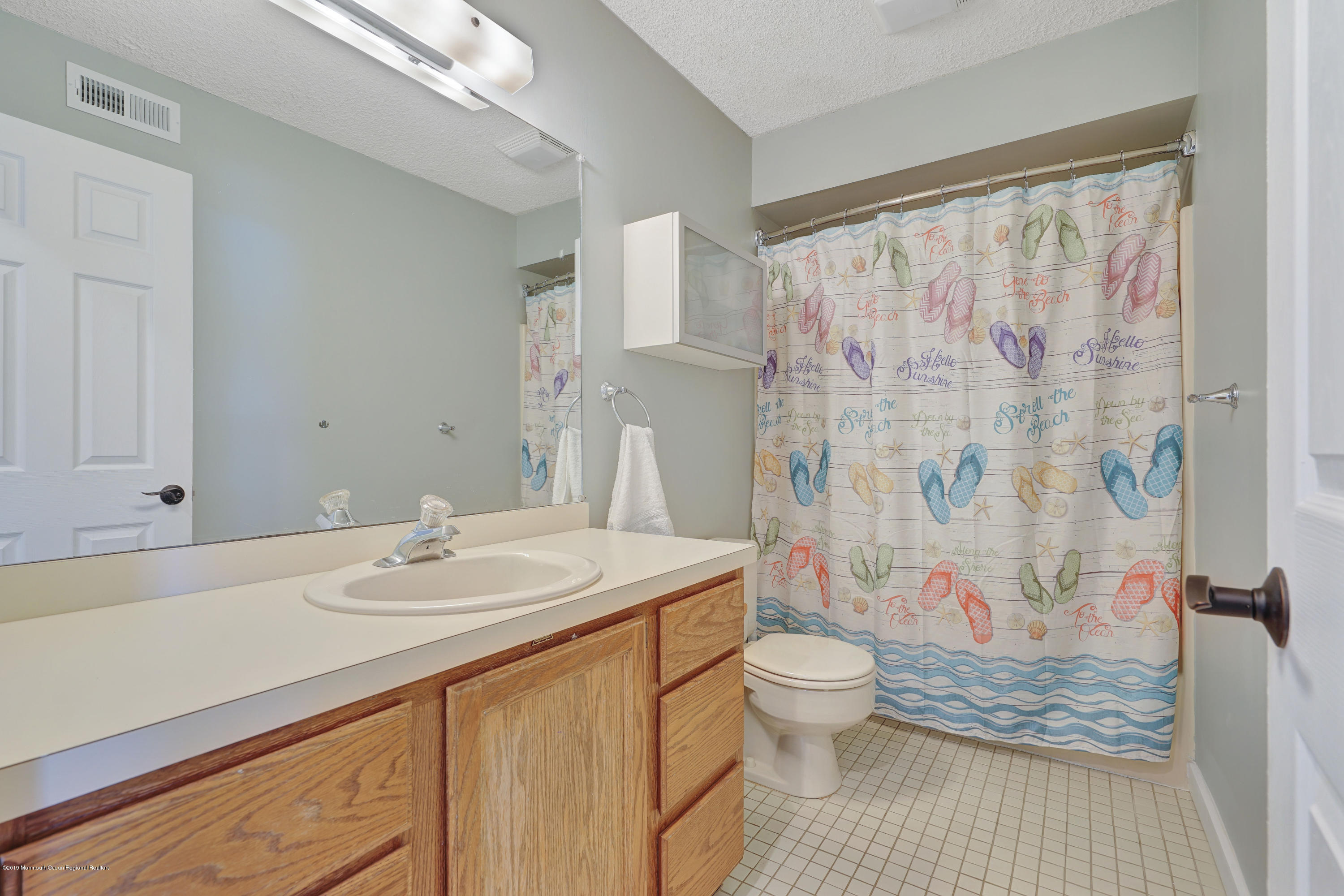 42 Hamilton Avenue, Unit B11 Seaside Heights, NJ 08751 - Photo 19 of 24 a bathroom with a sink toilet and shower