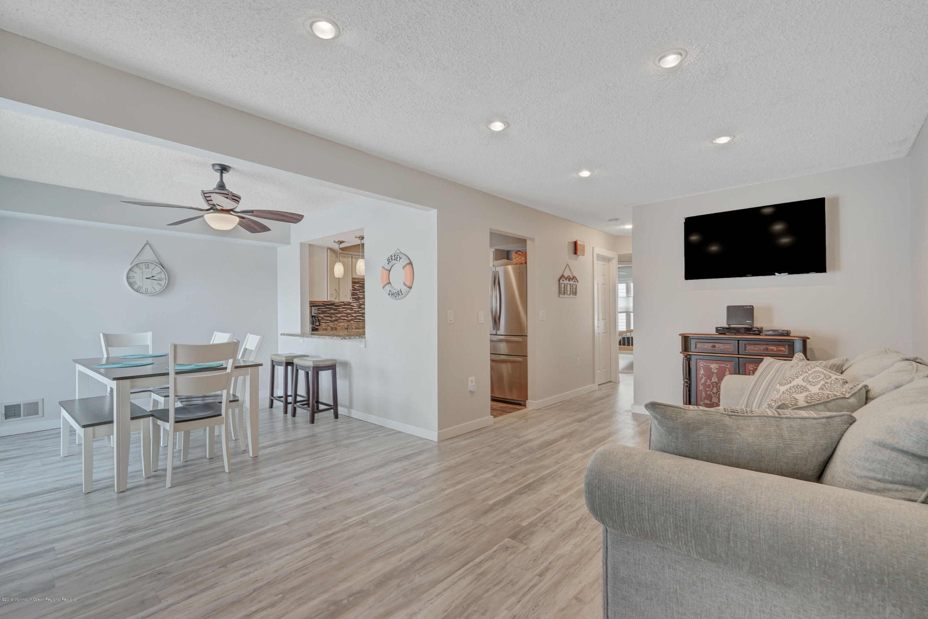 42 Hamilton Avenue, Unit B11 Seaside Heights, NJ 08751 - Photo 3 of 24 a living room with furniture and a flat screen tv