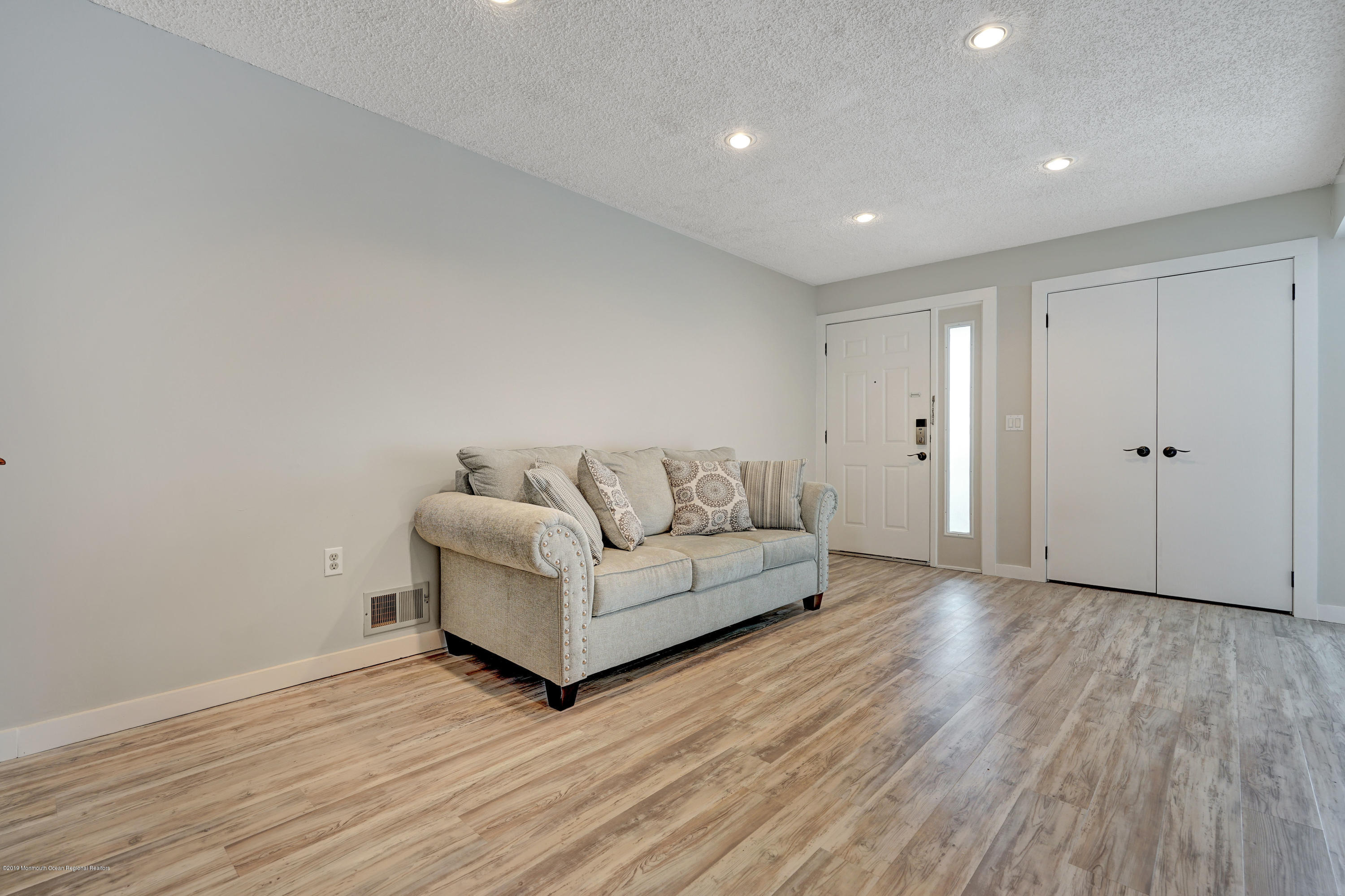 42 Hamilton Avenue, Unit B11 Seaside Heights, NJ 08751 - Photo 5 of 24 a living room with furniture and wooden floor