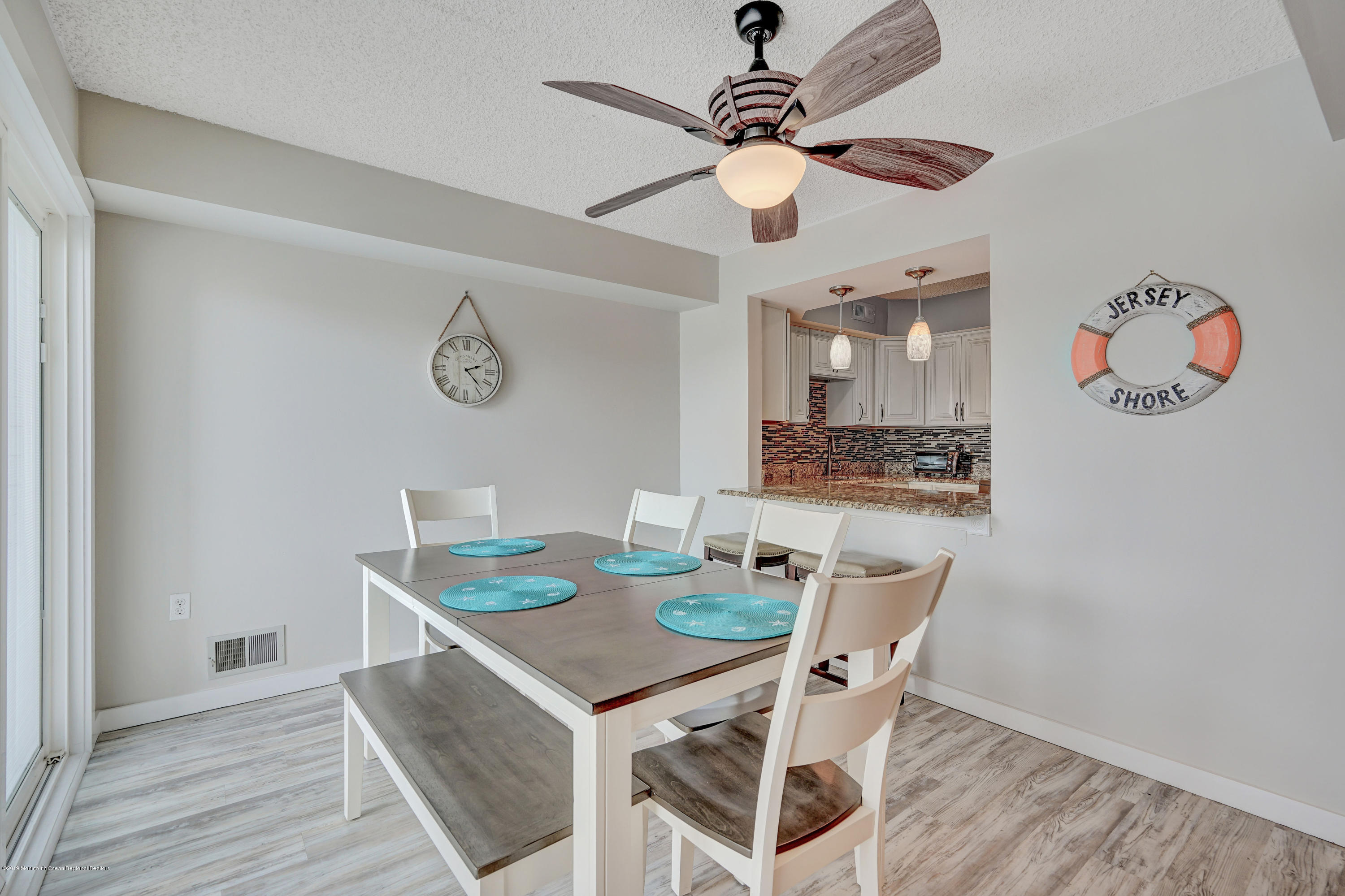42 Hamilton Avenue, Unit B11 Seaside Heights, NJ 08751 - Photo 9 of 24 a view of a dining room with furniture and wooden floor