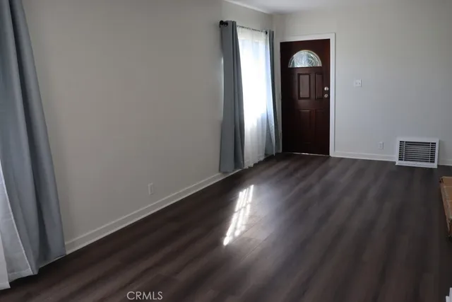 a view of a livingroom with wooden floor