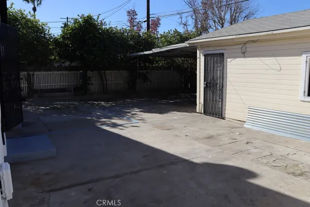 a side view of a house with a yard