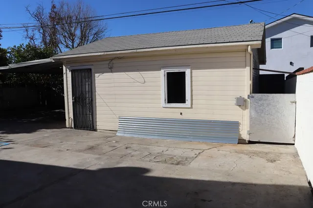 a view of a house with a barbeque