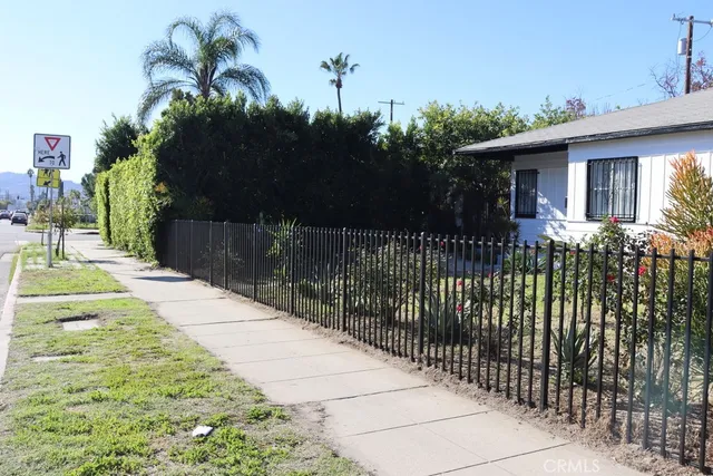 a view of a house with a small yard and plants
