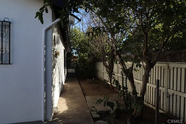 a view of a house with a wooden wall