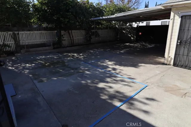 an empty room with wooden floor and closet