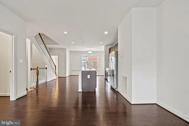 a view of an entryway with wooden floor