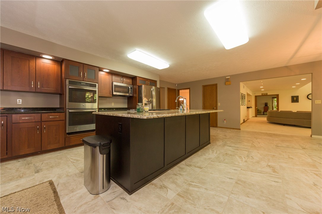 817 Hanover Road Gates Mills, OH 44040 - Photo 9 of 35 The open plan design of the remodeled Kitchen has exceptional cabinetry for all your storage needs. The center island is in contrasting colors with a huge granite worktop and with preparation sink and breakfast bar