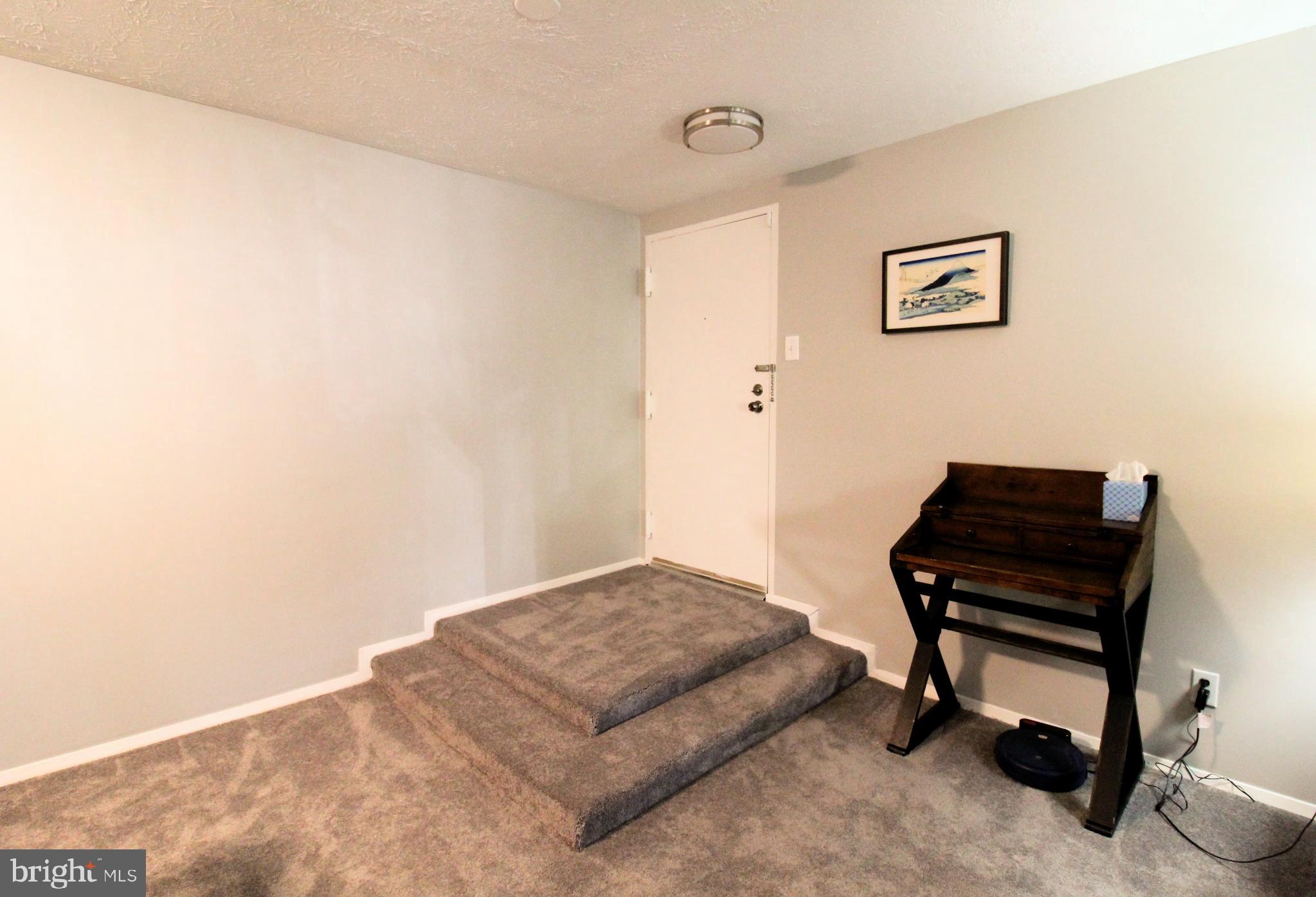 1503 Largo Road, Unit 101 Henrico, VA 23238 - Photo 15 of 35 a bedroom with a bed and piano