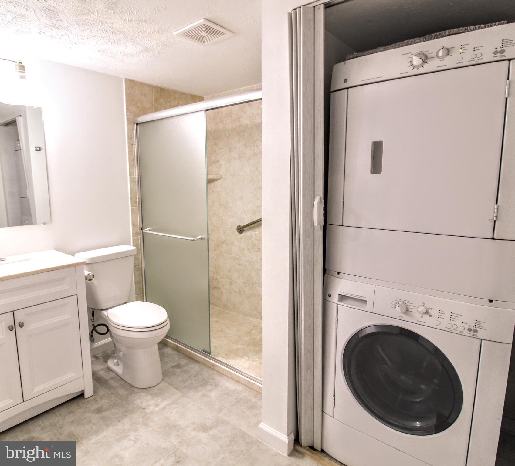 1503 Largo Road, Unit 101 Henrico, VA 23238 - Photo 18 of 35 a white toilet sitting next to a bathroom sink