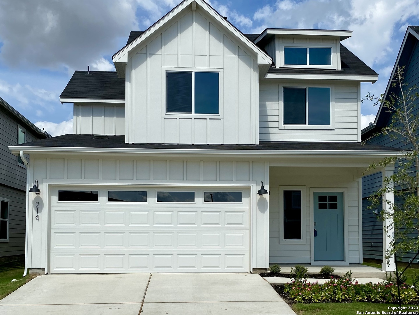 a view of a house with more windows and plants