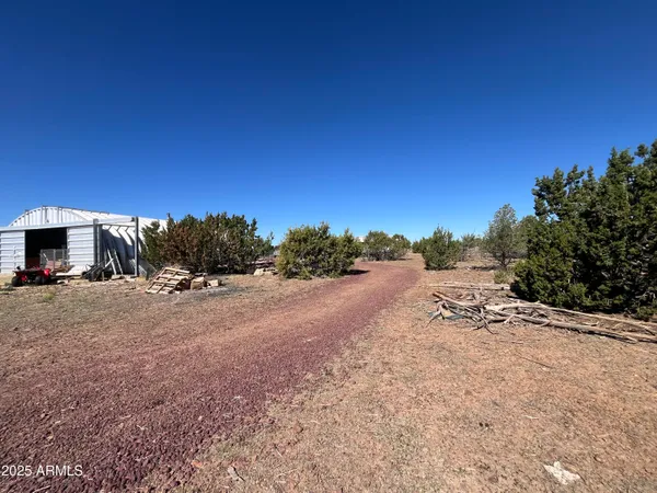 a view of a road with a building in the background