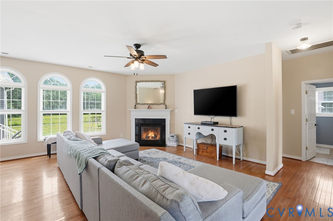 5305 Wellington Ridge Road Richmond, VA 23231 - Photo 14 of 67 Living area featuring hardwood flooring, a firepla