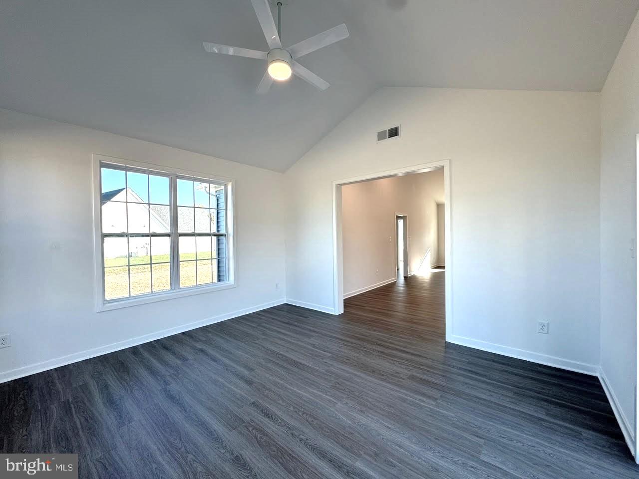 13 Glenaire Road Bunker Hill, WV 25413 - Photo 10 of 23 an empty room with wooden floor and windows