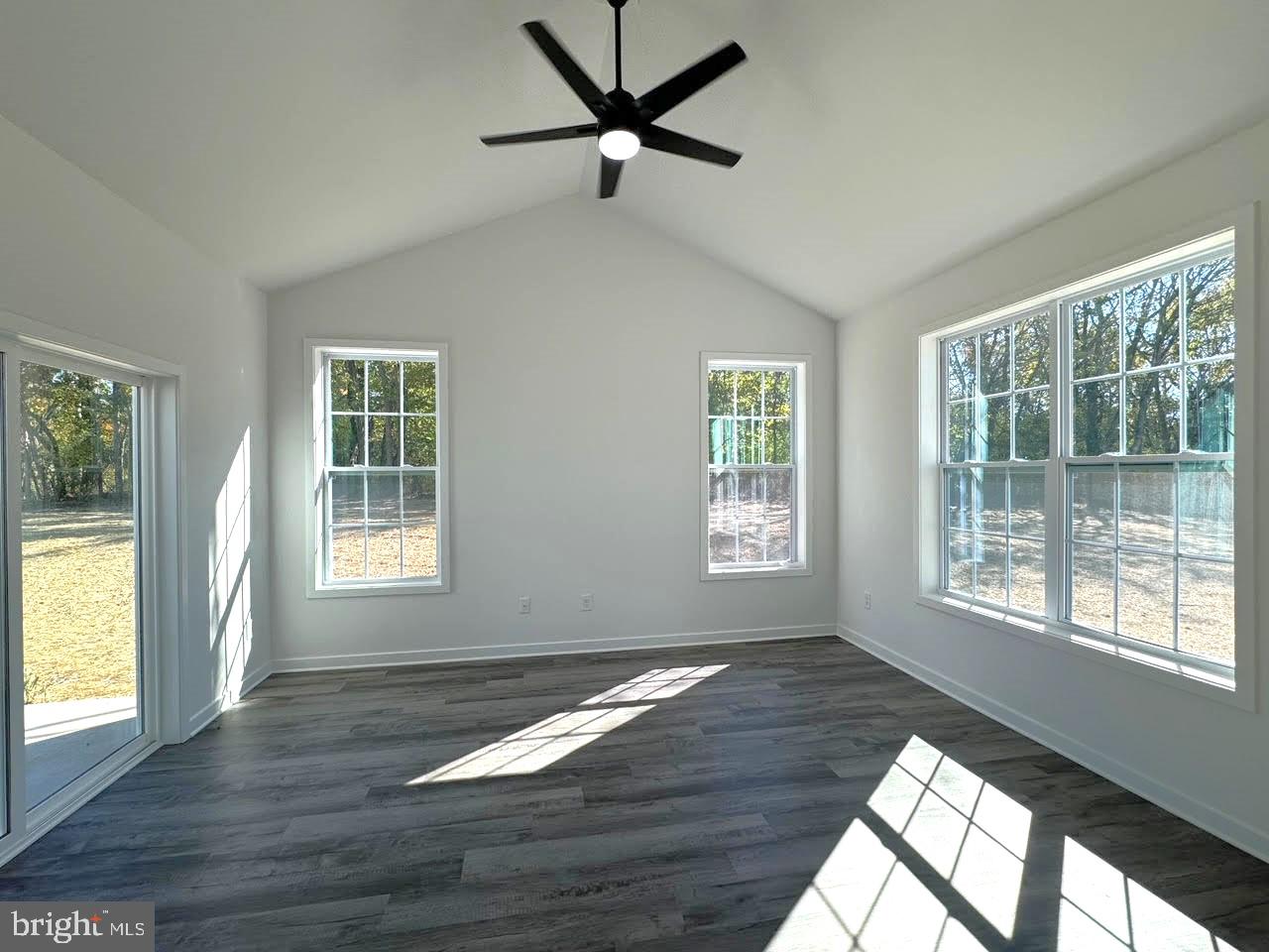 13 Glenaire Road Bunker Hill, WV 25413 - Photo 11 of 23 a view of an empty room with wooden floor and a window