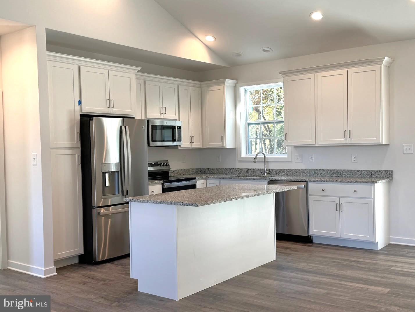 13 Glenaire Road Bunker Hill, WV 25413 - Photo 2 of 23 a kitchen with stainless steel appliances granite countertop a refrigerator a stove a sink and white cabinets