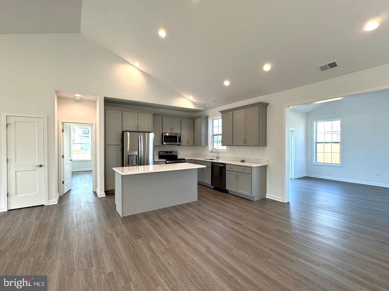 13 Glenaire Road Bunker Hill, WV 25413 - Photo 6 of 23 a large kitchen with a center island and wooden floor