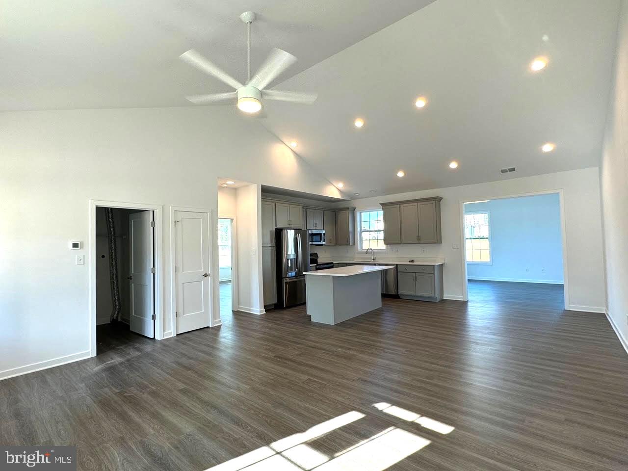 13 Glenaire Road Bunker Hill, WV 25413 - Photo 23 of 23 a kitchen with stainless steel appliances kitchen island granite countertop wooden floors and view living room
