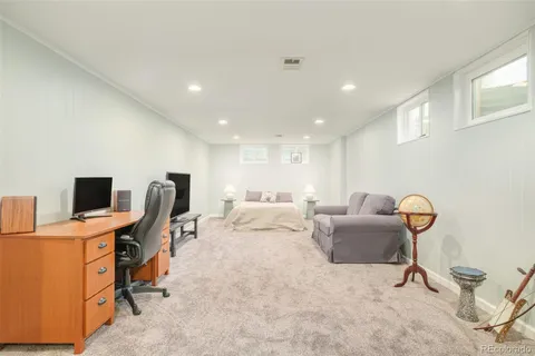 a bedroom with a workspace