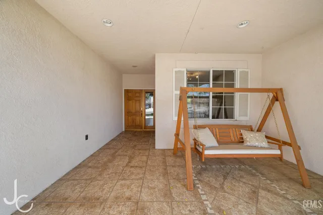 a view of an empty room with stairs