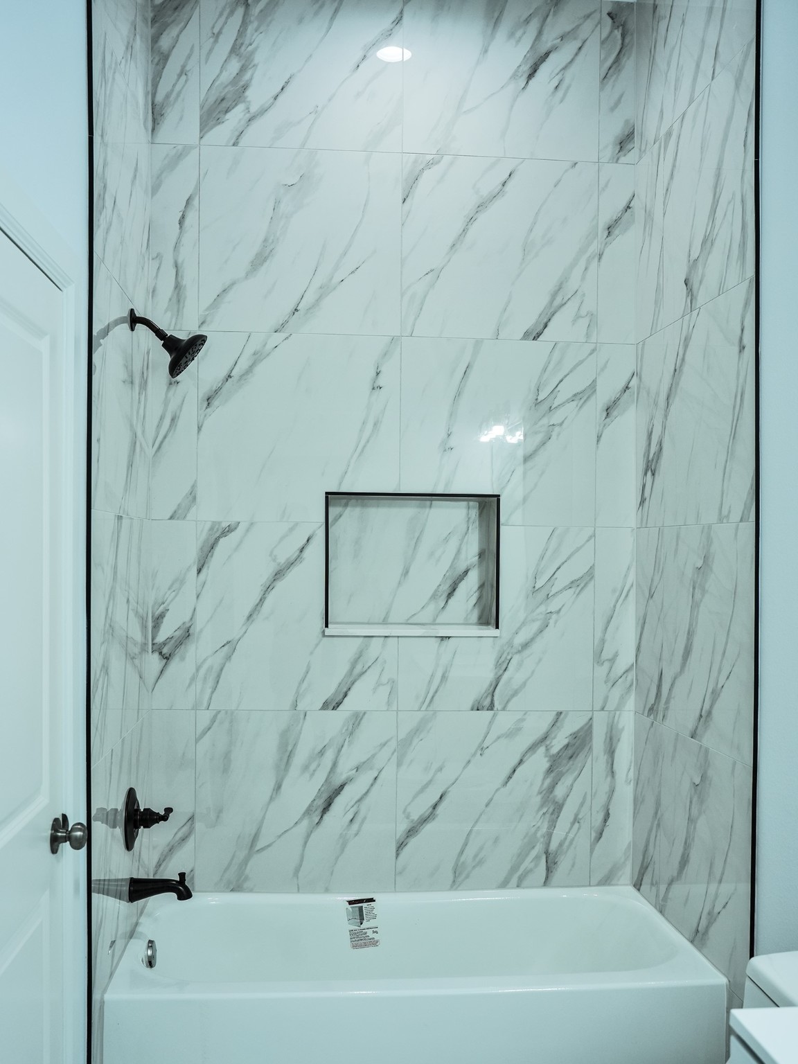 9435A Oberrender Road Needville, TX 77461 - Photo 26 of 36 a bathroom with a bathtub